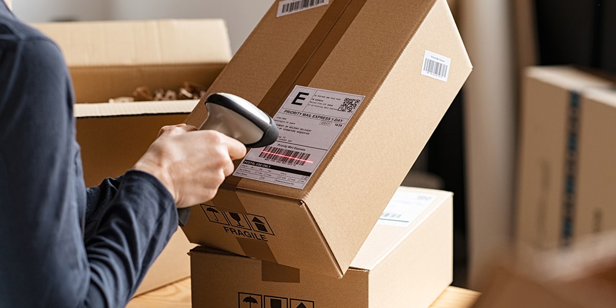 Individual scanning a shipping label